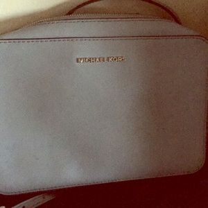 A gently used Michael Kors crossbody in light blue
